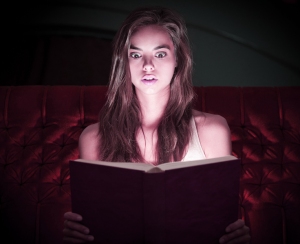 girl reading spooky book